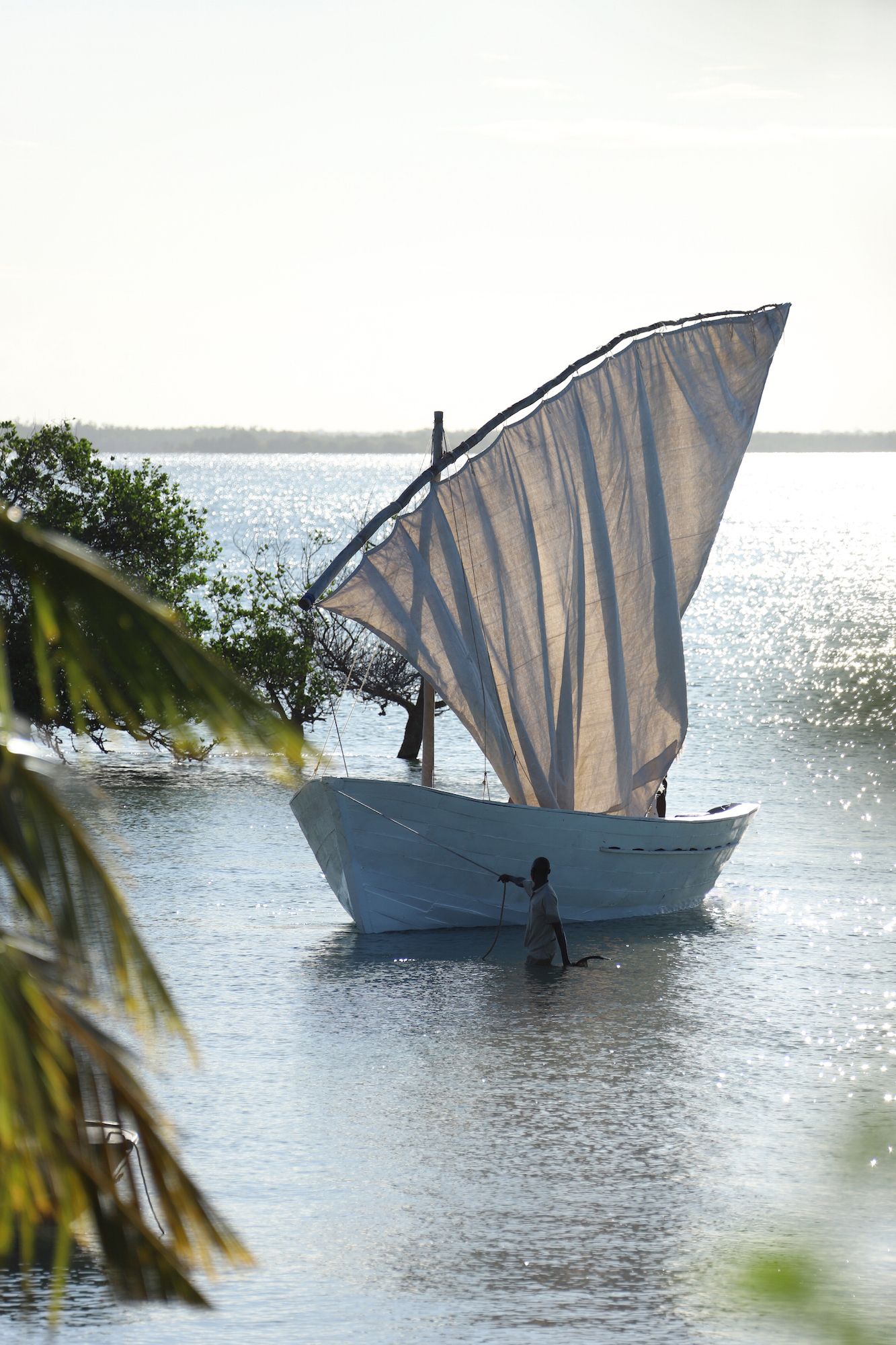 Image may contain Boat Sailboat Transportation Vehicle Watercraft Person Outdoors Water Nature and Sky