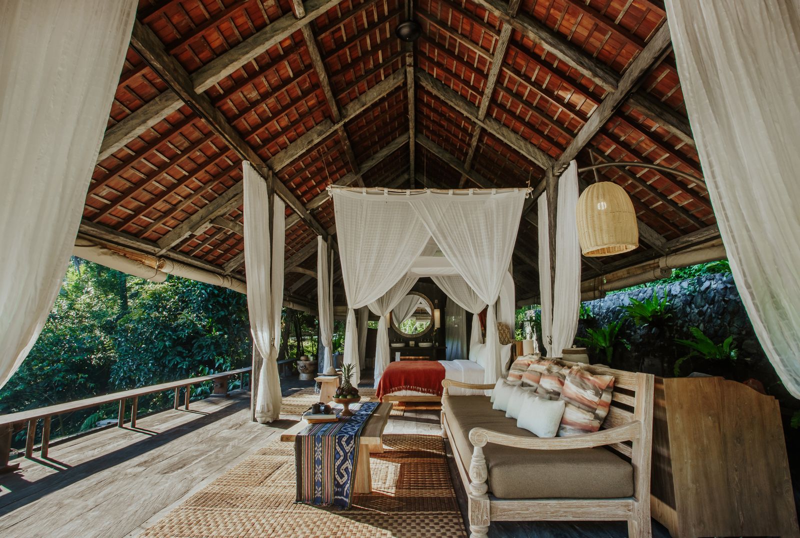 Image may contain Furniture Indoors Bed Bedroom Room Plant Canopy Bed and Couch