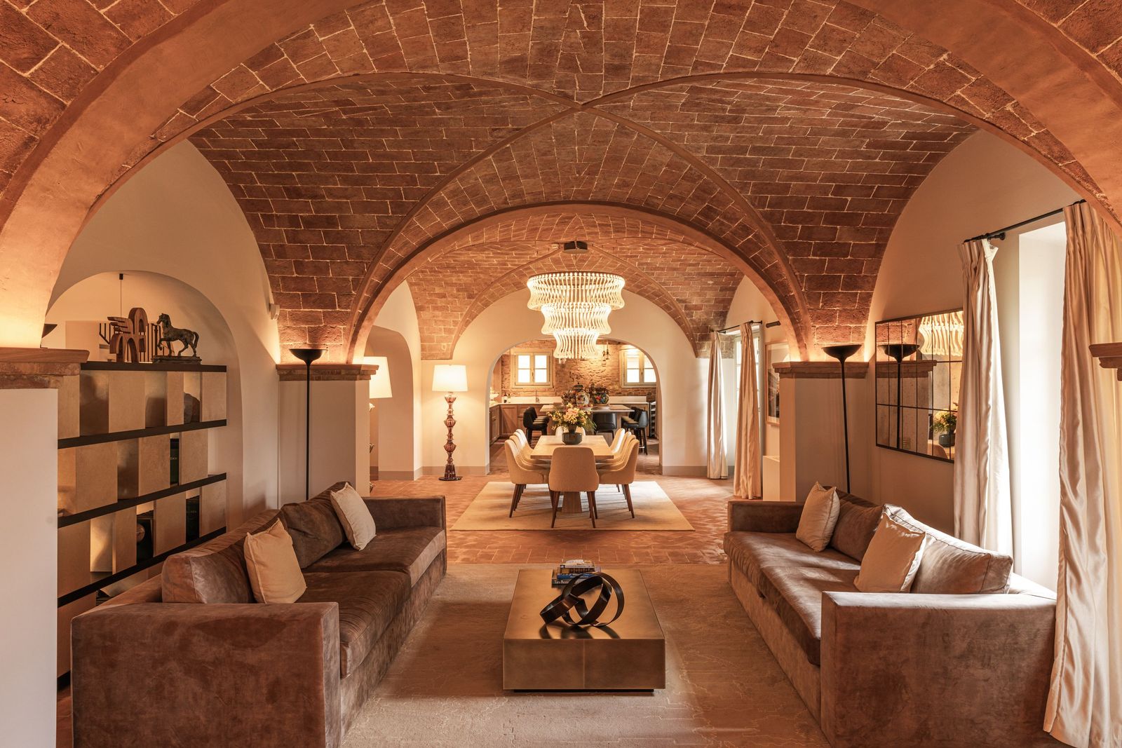 Image may contain Architecture Vault Ceiling Floor Home Decor Rug Indoors Couch Furniture Lamp and Building