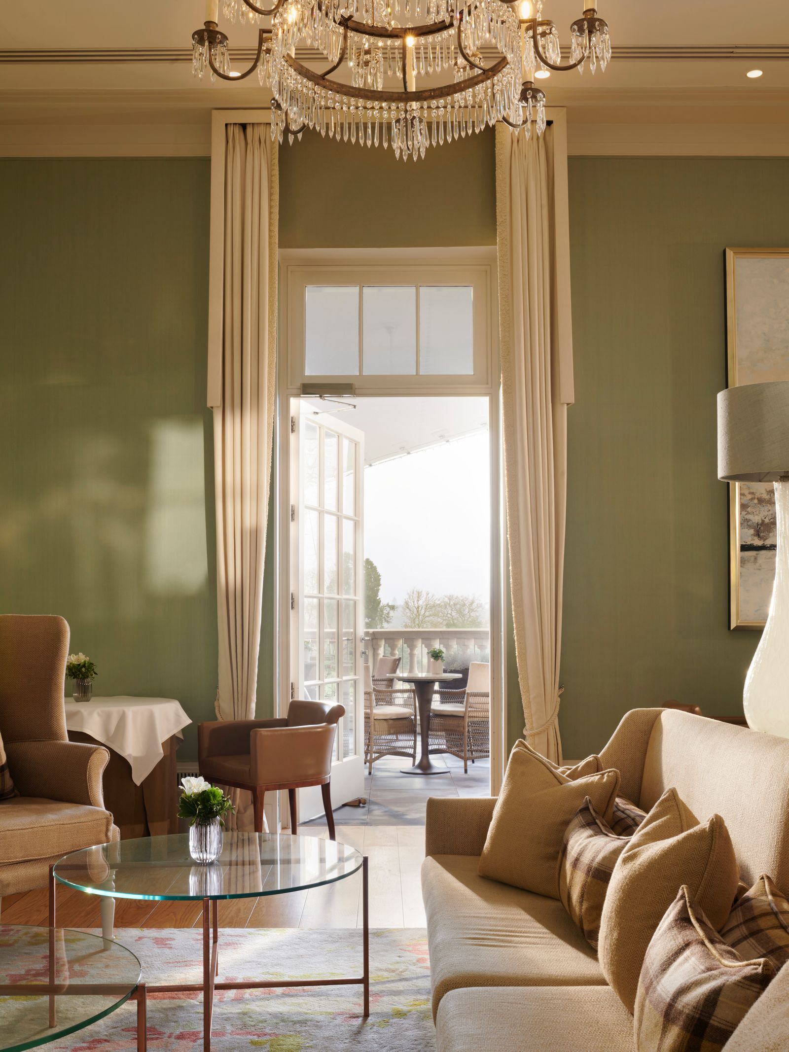 Image may contain Home Decor Architecture Building Furniture Indoors Living Room Room Table Couch and Chair