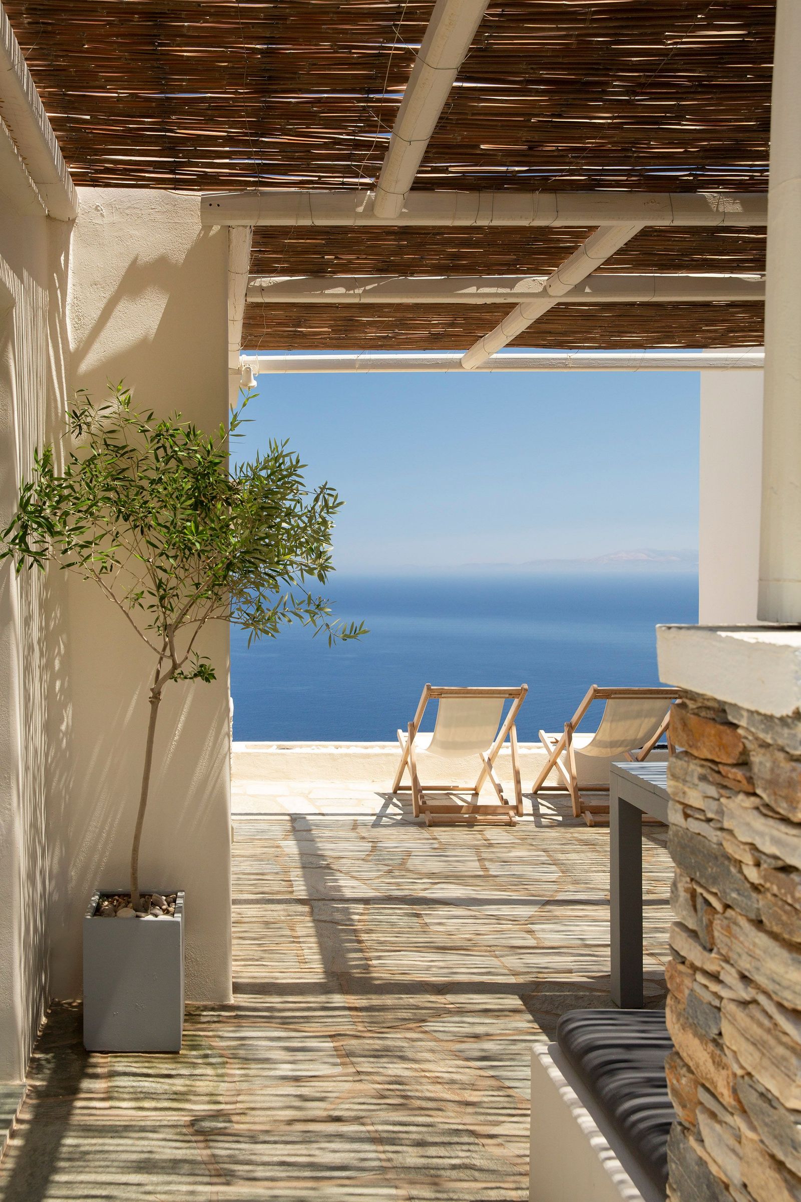 Image may contain Indoors Interior Design Nature Outdoors Scenery Chair Furniture Wood Architecture and Balcony