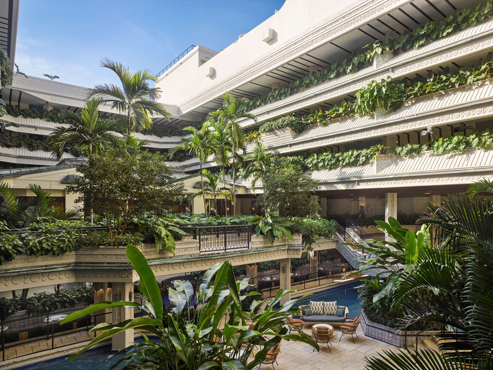 Image may contain Architecture Building Hotel Resort Pool Water Swimming Pool House Housing Villa and Chair