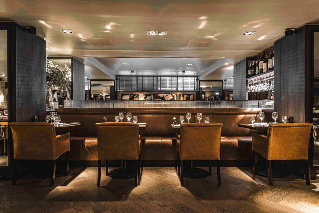 Image may contain Architecture Building Dining Room Dining Table Furniture Indoors Room Table Chair and Restaurant